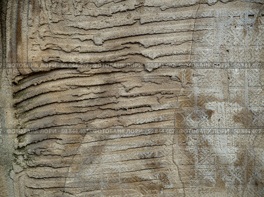 Abstract stone background of old rough plaster. Stripes are visible on the surface - grooves and imprints of the back side of the tile. Стоковое фото, фотограф Бузмакова Светлана / Фотобанк Лори