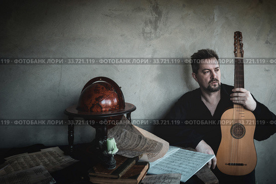 Adult man in historical suit with renaissance vihuela. Стоковое фото, фотограф Дмитрий Черевко / Фотобанк Лори
