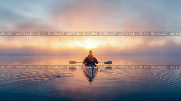 Adventurous solo paddler in a kayak on tranquil lake at golden hour, surrounded by colorful morning fog, ideal for outdoor leisure content. Стоковое AI-изображение, AI-художник Данила Большаков / Фотобанк Лори