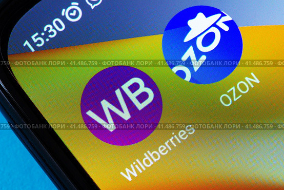 Adygea, Russia - August 13, 2023: icons of popular mobile applications marketplace Wildberries, Ozon on the screen of an android smartphone xiaomi close-up. Редакционное фото, фотограф Андрей С / Фотобанк Лори