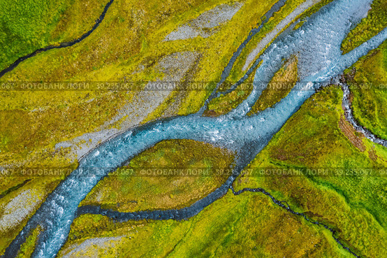 Aerial top down view of glacial river in Iceland, drone shot. Стоковое фото, фотограф Igor Tichonow / Фотобанк Лори
