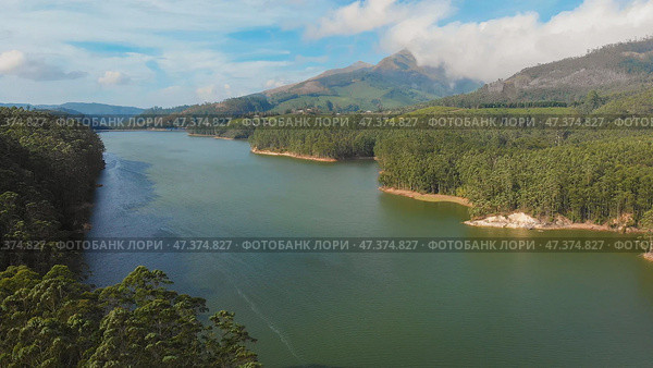 Aerial view beautiful nature with mountains and hills by Lake Mattupetty. Kerala State. Near the city of Munar. Стоковое фото, фотограф Mikhail Davidovich / Фотобанк Лори