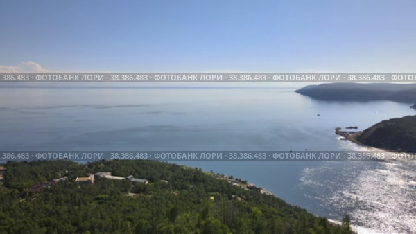 Aerial view of Lake Baikal and the source of the Angara River (2022 год). Редакционное видео, видеограф Mixail59 / Фотобанк Лори