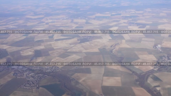 Aerial view on agriculture fields in France. Стоковое видео, видеограф Михаил Коханчиков / Фотобанк Лори