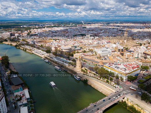 Aerial view Sevilla of city center with embankment of Guadalquivir. Стоковое фото, фотограф Яков Филимонов / Фотобанк Лори
