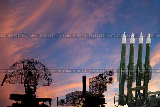 Air defense radars of military mobile anti aircraft systems and modern Russian anti-aircraft missiles OSA-AKM on the background of the sunset orange sky,Russia. Стоковое фото, фотограф Владимир Журавлев / Фотобанк Лори