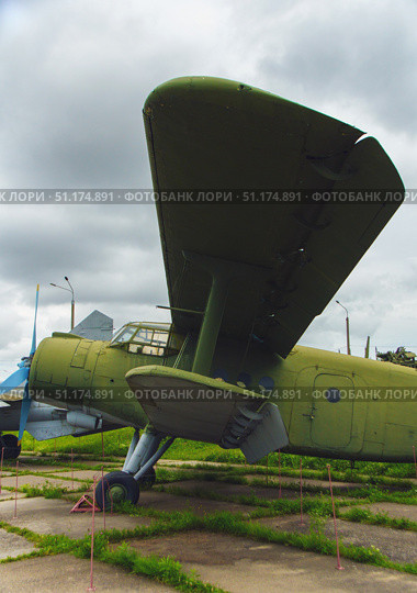 An old Soviet AN-2 aircraft in green camouflage. Belarus. Minsk. 09.08.2025. Редакционное фото, фотограф Ярославский Максим / Фотобанк Лори