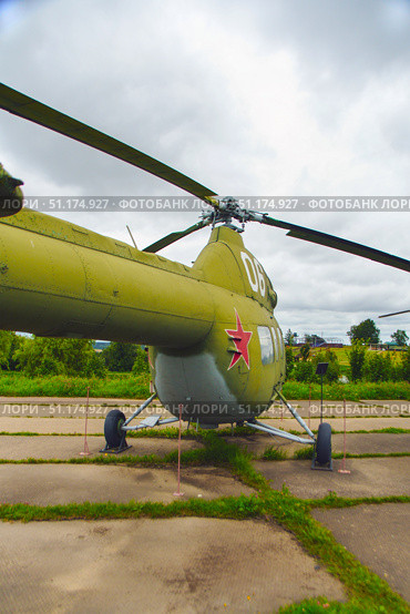 An old Soviet MI-2 small combat helicopter under a gloomy sky. Belarus. Minsk. 09.08.2025. Редакционное фото, фотограф Ярославский Максим / Фотобанк Лори