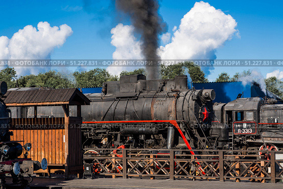 An old Soviet steam locomotive of the L series. The Ruskeala Express retro train is at the Sortavala station. Russia, Republic of Karelia, Sortavala, August 12, 2025. Редакционное фото, фотограф Photojuli / Фотобанк Лори