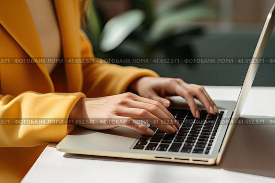 An unidentified young girl in a yellow jacket is typing on a laptop. Generated by AI. Стоковое AI-изображение, AI-художник Ярославский Максим / Фотобанк Лори