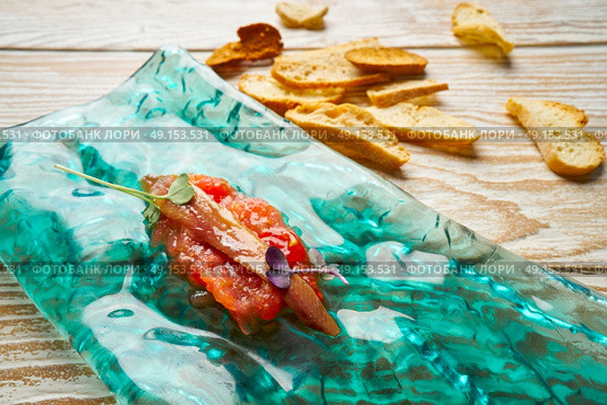 Anchovies on fresh grated tomato starter tapas. Стоковое фото, агентство Ingram Publishing / Фотобанк Лори