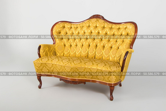 Antique sofa, studio shot with shadows.Photo taken on: December 30th, 2015. Стоковое фото, агентство Ingram Publishing / Фотобанк Лори