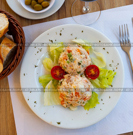Appetizing Olivier salad with eggs, greens, vegetables, lettuce. Spanish cuisine. Стоковое фото, фотограф Яков Филимонов / Фотобанк Лори