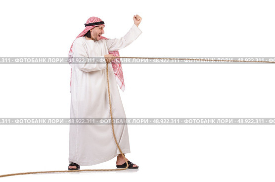 Arab in tug of war concept on white. Стоковое фото, агентство Ingram Publishing / Фотобанк Лори
