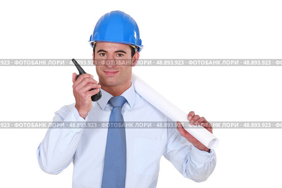 Architect with a two-way radio. Стоковое фото, агентство Ingram Publishing / Фотобанк Лори