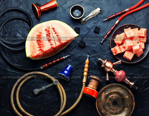 Aromatic smoking hookah with watermelon flavored tobacco. Mouthpiece for smoking hookah. Стоковое фото, агентство Ingram Publishing / Фотобанк Лори