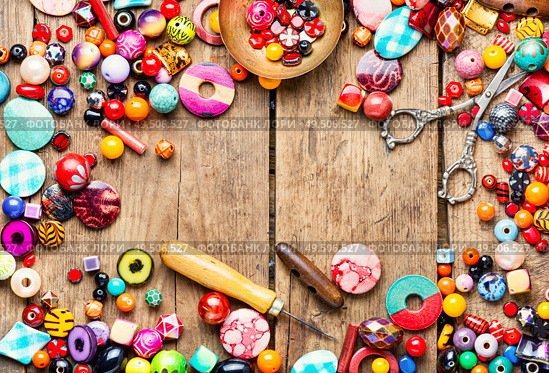 Assortment beads for making women’s jewelry.Bright colored beads. Making of handmade jewellery. Стоковое фото, агентство Ingram Publishing / Фотобанк Лори