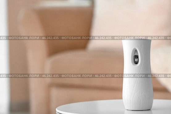 Automatic air freshener on table in room. Стоковое фото, фотограф Pixel_shot / Фотобанк Лори