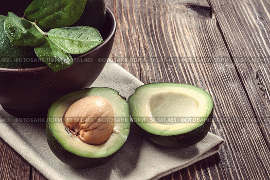 avocado on a wooden table old. Стоковое фото, агентство Ingram Publishing / Фотобанк Лори