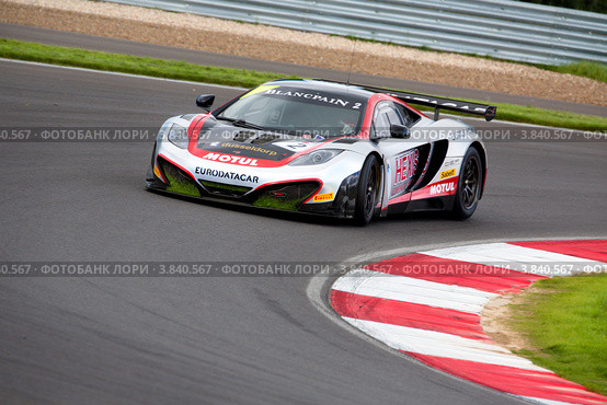 Автомобиль McLaren GT MP4-12C команды Hexis Racing участвует в Чемпионате Eвропы FIA GT1 на трассе "Moscow Raceway" в Подмосковье (2012 год). Редакционное фото, фотограф Николай Винокуров / Фотобанк Лори
