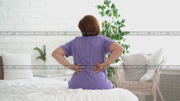 Back pain, kidney inflammation, woman suffering from backache at home, health problems concept. Стоковое видео, видеограф Станислав Тарко / Фотобанк Лори