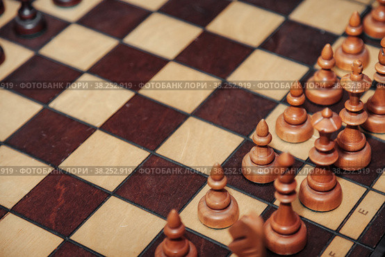 Background close-up chess pieces on chessboard game. Стоковое фото, фотограф Aleksandr Golubev / Фотобанк Лори
