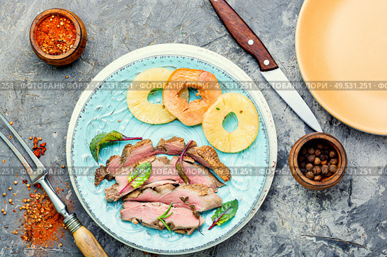 Baked duck meat with pineapple sauce.Fried duck breast. Roasted duck with ananas. Стоковое фото, агентство Ingram Publishing / Фотобанк Лори