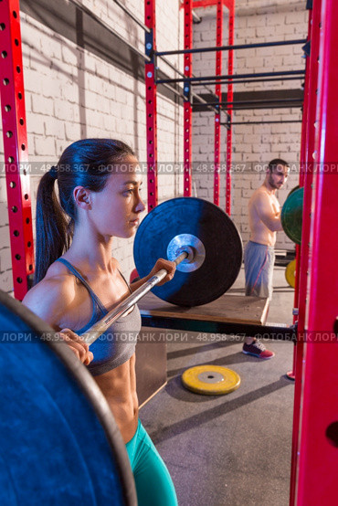 Barbell weight lifting group weightlifting workout exercise gym. Стоковое фото, агентство Ingram Publishing / Фотобанк Лори