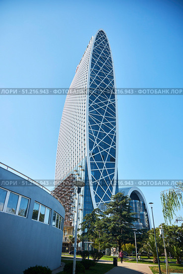 Batumi, Georgia. - July 04, 2023: the buildings of modern architecture in which the Marriott hotel is located in the center of Batumi. Редакционное фото, фотограф Наталия Кирсанова / Фотобанк Лори