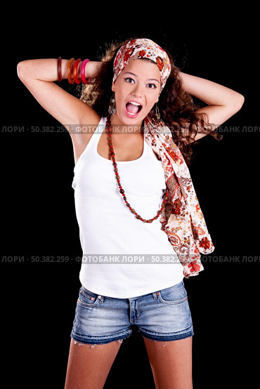 Beautiful and fashion young woman isolated on a black background. Стоковое фото, агентство Ingram Publishing / Фотобанк Лори
