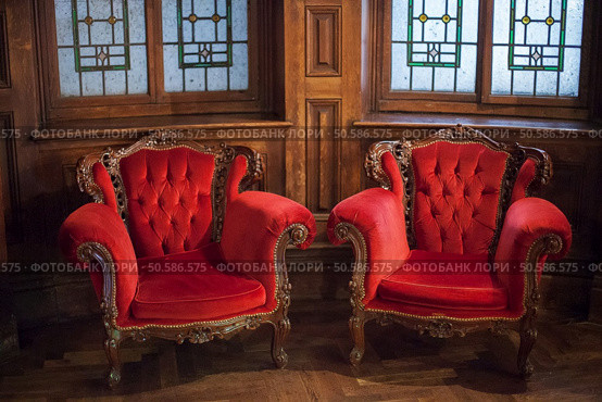 Beautiful and opulent antique red velvet chairs in timber interior. Red Velvet Chairs. Стоковое фото, агентство Ingram Publishing / Фотобанк Лори
