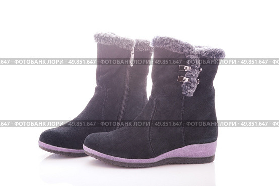 Beautiful, black boots with zips and buckles made of suede. On a white background. Стоковое фото, агентство Ingram Publishing / Фотобанк Лори