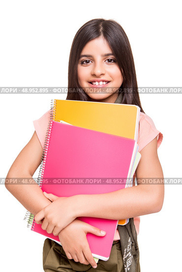Beautiful little girl holding sketchbooks over white. Стоковое фото, агентство Ingram Publishing / Фотобанк Лори