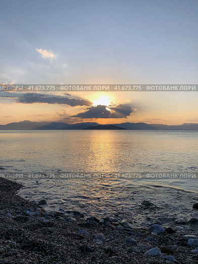 Beautiful sunset at the seaside, Greece. Редакционное фото, фотограф Екатерина Каляева / Фотобанк Лори