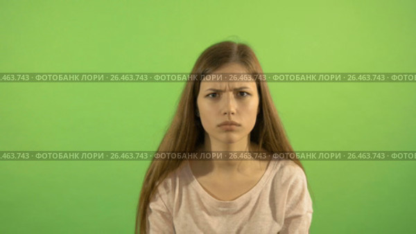 Beautiful white model is playing on the green screen background. He laughs and smiles. Displays different images. Стоковое видео, видеограф Игорь Усачев / Фотобанк Лори