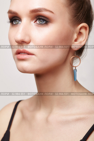 Beautiful woman with galvanic earring in form blue crystal. Стоковое фото, фотограф Сергей Пристяжнюк (Serg Zastavkin) / Фотобанк Лори