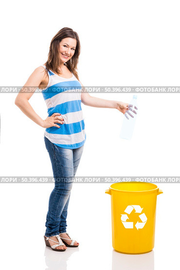 Beautiful young woman doing recycling, isolated over white background. Стоковое фото, агентство Ingram Publishing / Фотобанк Лори