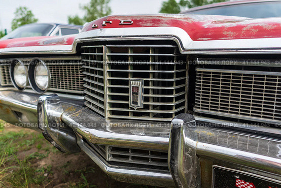 BERLIN - APRIL 27, 2019: Fragment of the full-size station wagon Ford LTD Country Squire, 1972. Редакционное фото, фотограф Sergey Kohl / Фотобанк Лори