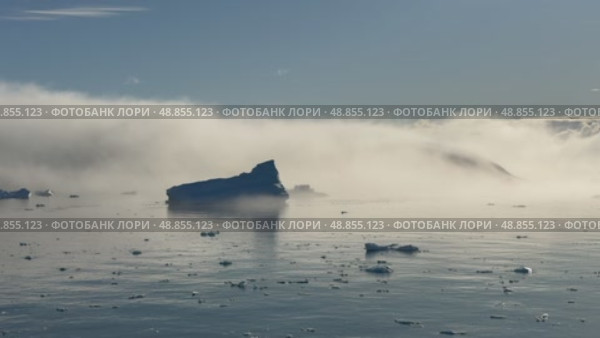 Big Iceberg in Antarctica Winter Scenery, Amazing Shape Ice Formation of Massive Large Enormous Blue Icebergs in Antarctic Peninsula Landscape Seascape with Ocean Sea Water. Стоковое видео, видеограф Vladimir / Фотобанк Лори