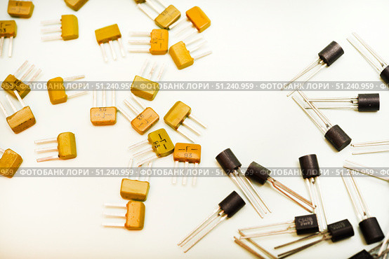 Bipolar transistors on a white background. Semiconductor devices. Microelectronics. Стоковое фото, фотограф Valeriy Lushchikov / Фотобанк Лори