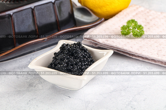 black sturgeon caviar in the bowl. Стоковое фото, фотограф Андрей Старостин / Фотобанк Лори