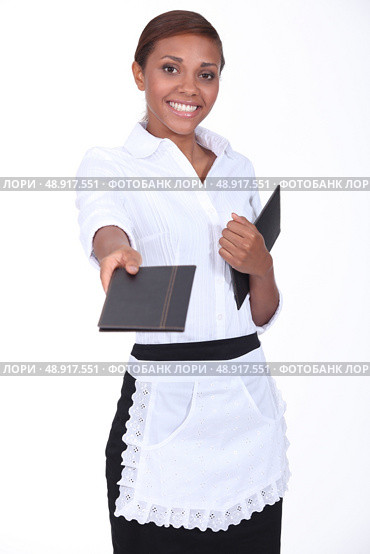 black waitress giving a menu. Стоковое фото, агентство Ingram Publishing / Фотобанк Лори