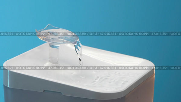 Blue background with small fountains from which drinking water runs. Стоковое фото, фотограф David Kashakhi / Фотобанк Лори