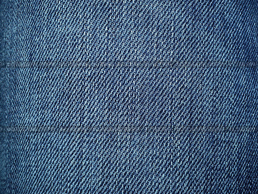 Blue denim. Texture of cotton coarse material. A fragment of a natural rag indigo. Vertical furrows, dark and light threads, individual stitches are noticeable. Стоковое фото, фотограф Юлия Петровская / Фотобанк Лори