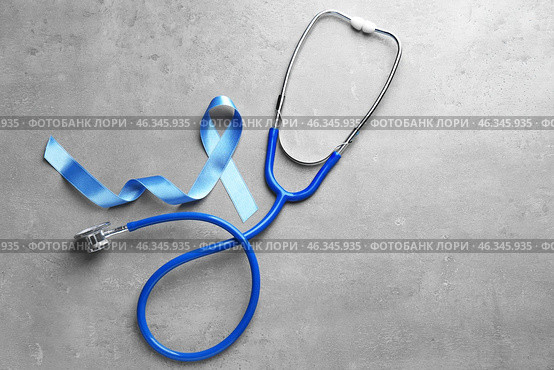 Blue ribbon and stethoscope on grey background. Prostate cancer awareness. Стоковое фото, фотограф Pixel_shot / Фотобанк Лори