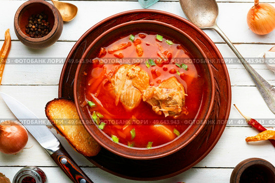 Borscht - hot soup based on beets and meat. Red Ukrainian borscht. Red Ukrainian borscht, dinner. Стоковое фото, агентство Ingram Publishing / Фотобанк Лори