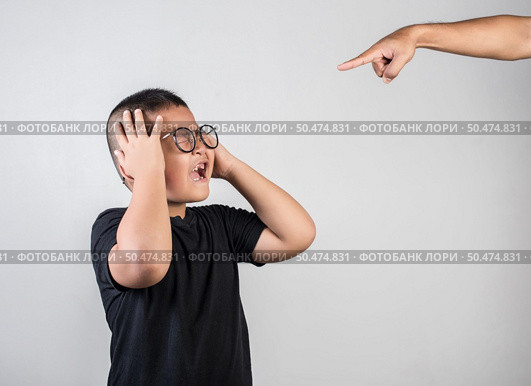 Boy feels sad after the parents scold him. Стоковое фото, агентство Ingram Publishing / Фотобанк Лори