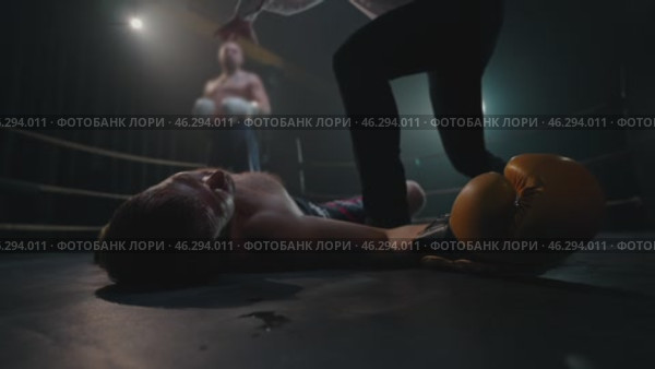 Brutal Boxing Knockout. Fallen Fighters Glove Drops as Referee Ends Fight. Редакционное видео, видеограф Михаил Матвеев / Фотобанк Лори