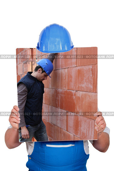 Builder hiding behind picture of construction site. Стоковое фото, агентство Ingram Publishing / Фотобанк Лори