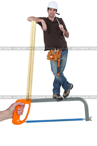 Builder standing on a saw. Стоковое фото, фотограф Phovoir Images / Фотобанк Лори